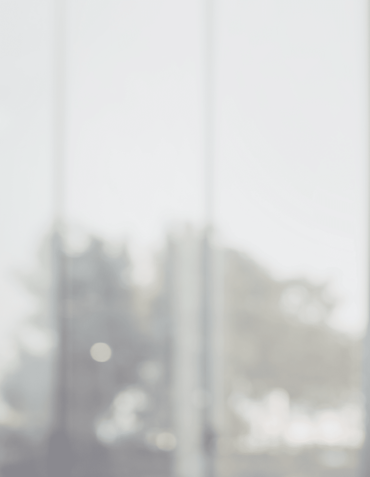 Blurred abstract glass wall from building in city town background.