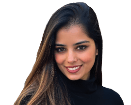 Person with long dark hair wearing a black top smiling against a white background. Description generated by AI