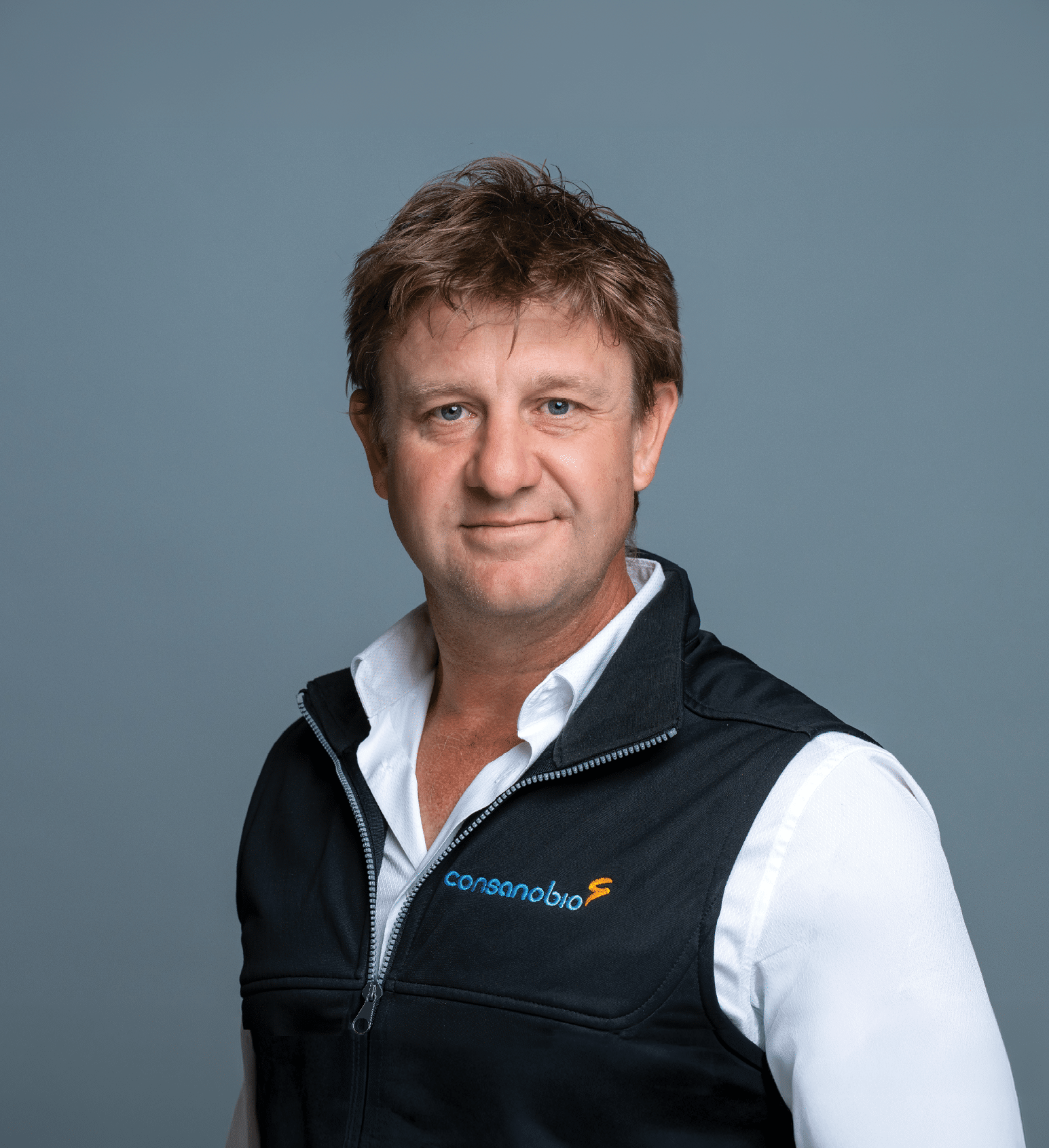 A man wearing a black vest with a logo on it. AI generated content